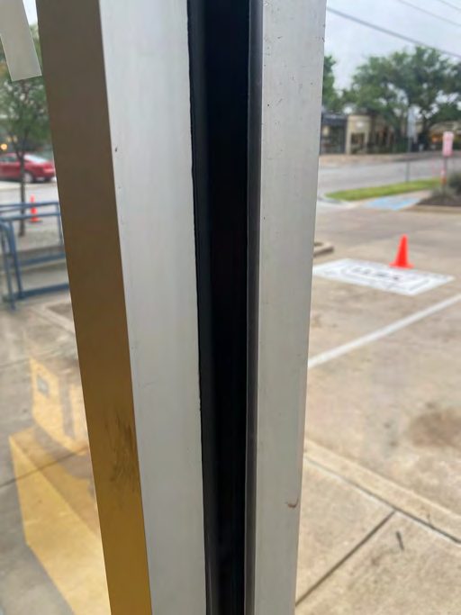 Correct security film installation by Epic: Vestibule door, uniform bead.
